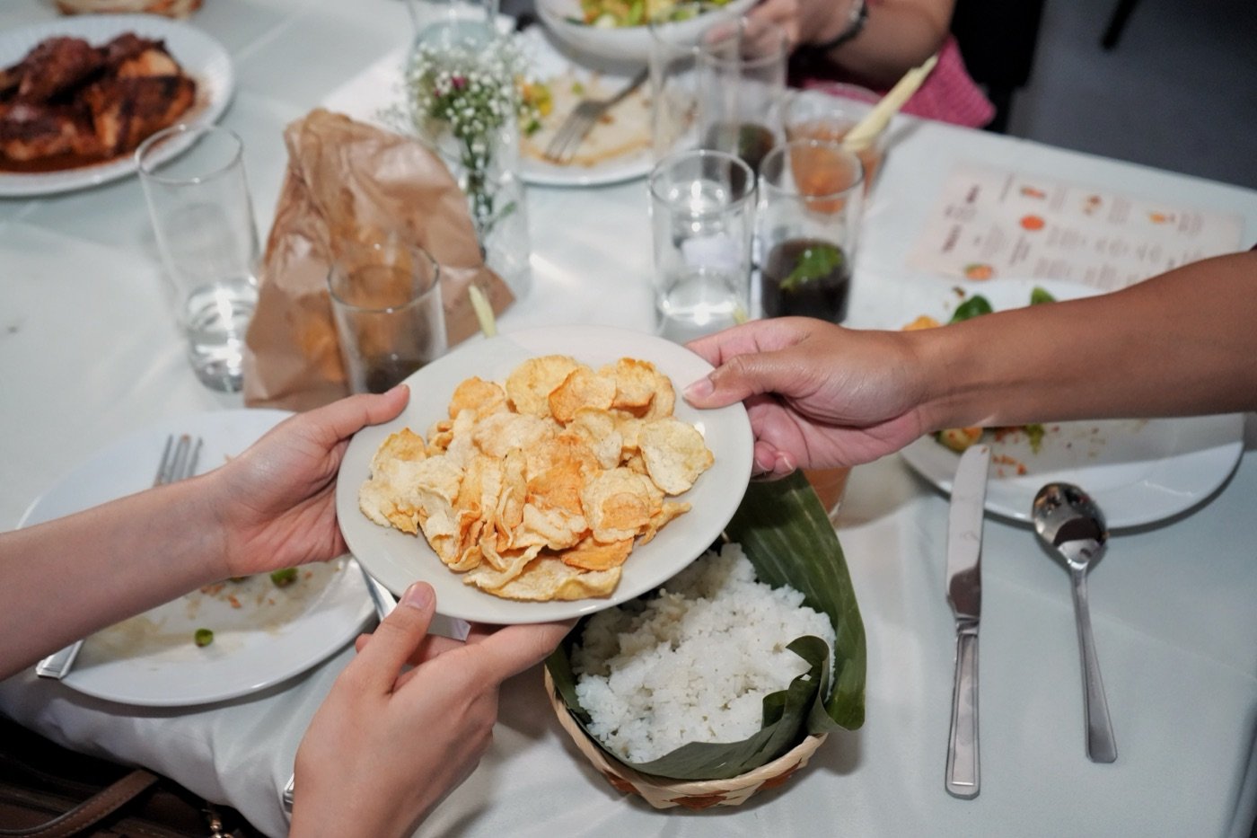 Kerupuk Emping, melinjo seed crackers, being passed around the table