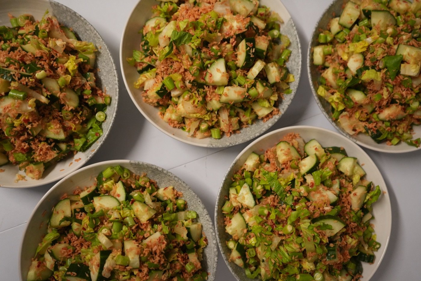 Trancam Sayur, spiced coconut vegetable salad plated for guests