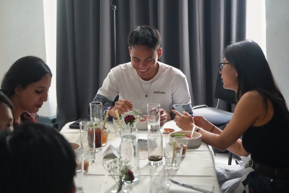 Guests laughing during dinner